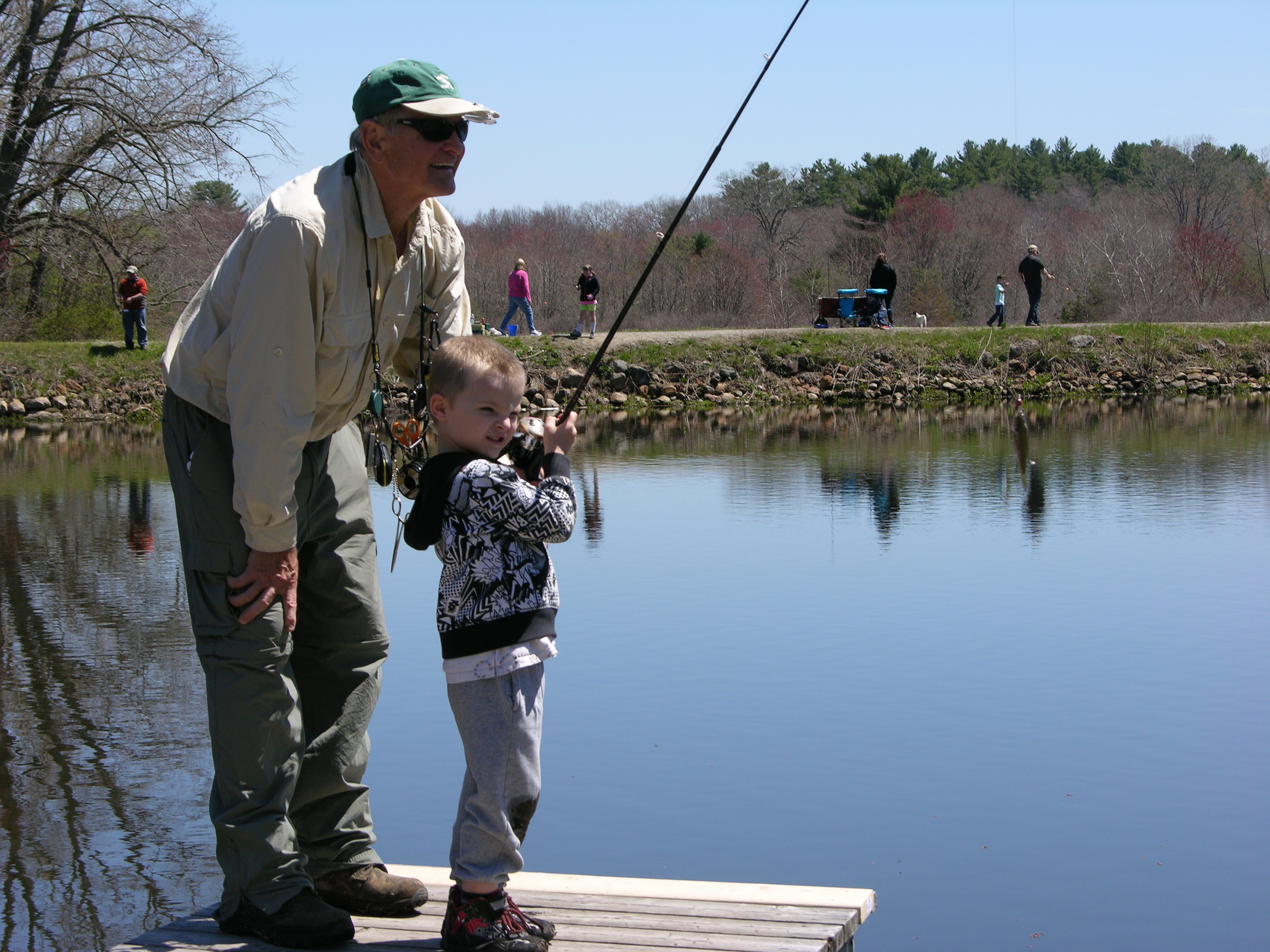 Boy and man fishing 